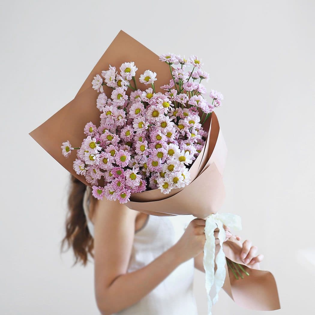 Brown paper pink daisey bouquet
